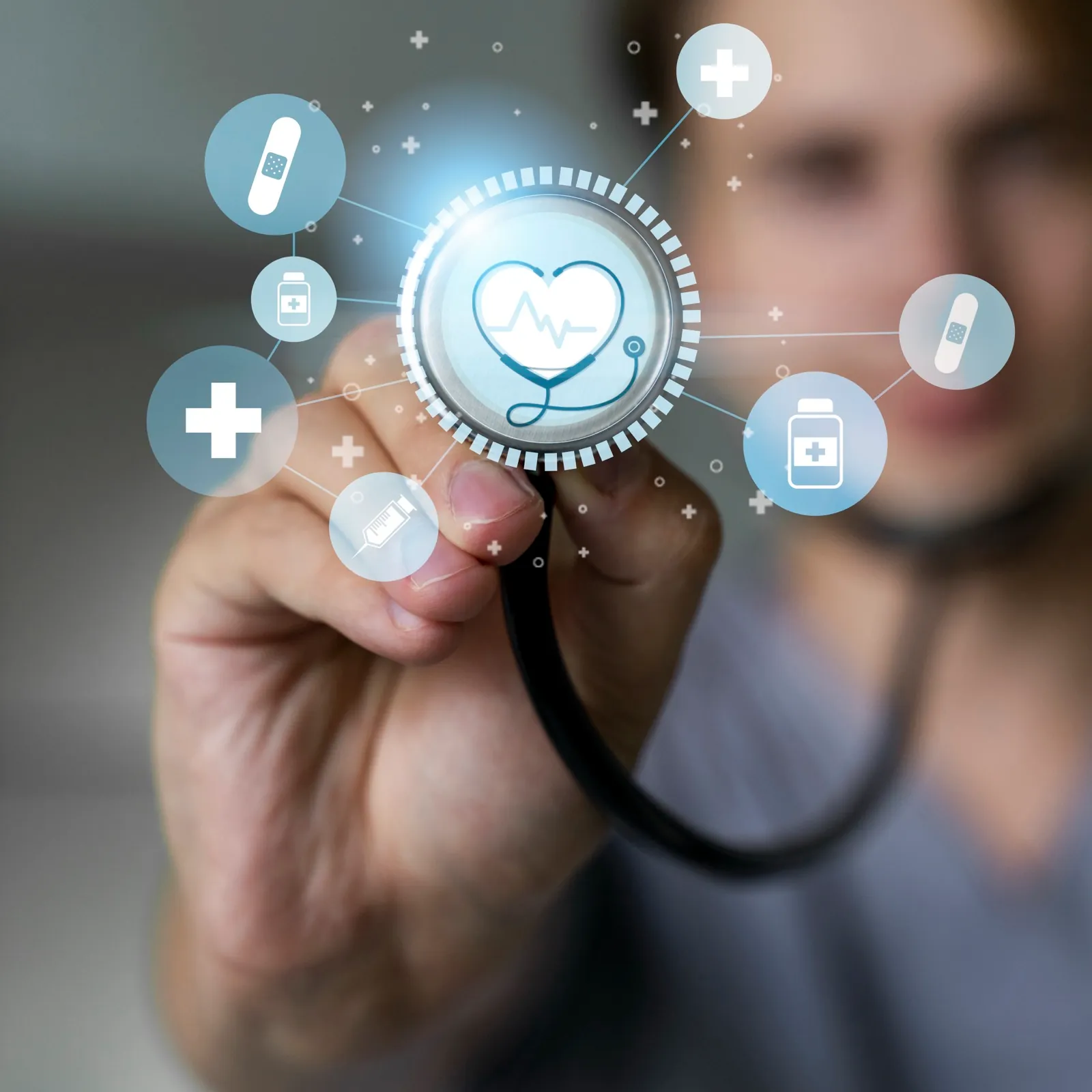A First MD provider holding out a stethoscope